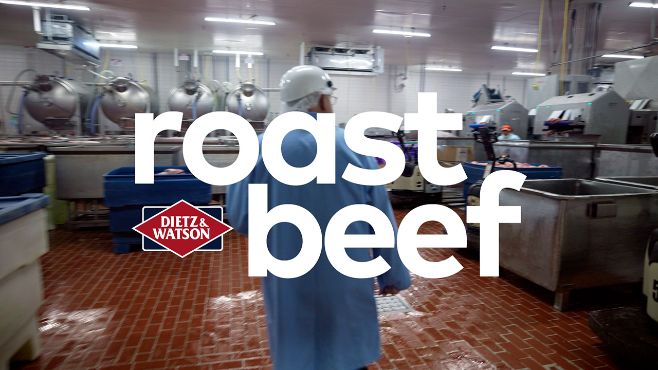 Dietz CEO, Louis, stands in a wide facility designed to process meat products.