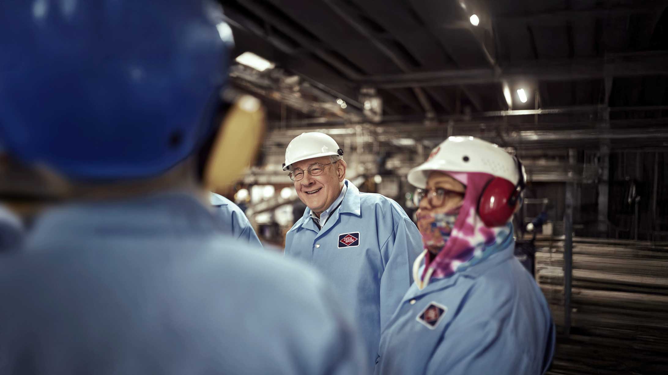 Dietz's CEO, Louis, is smiling while surrounded by the Dietz team.